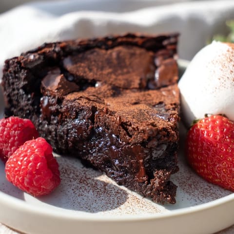 Close-up of a rich Decadent Dark Chocolate Brownie Tart, with a perfectly baked, fudgy center.