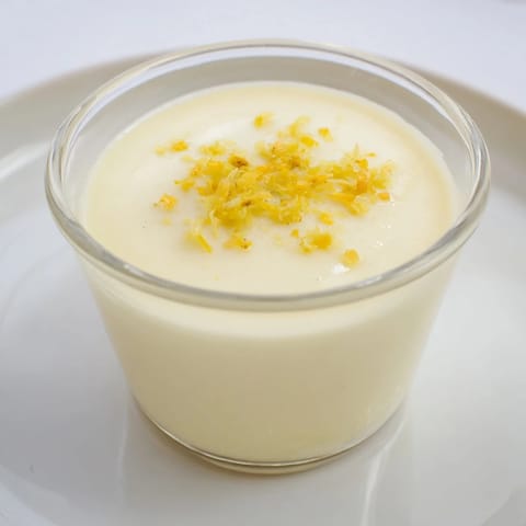 Silky 3-ingredient lemon posset, chilled and ready to serve, a simple yet elegant dessert.