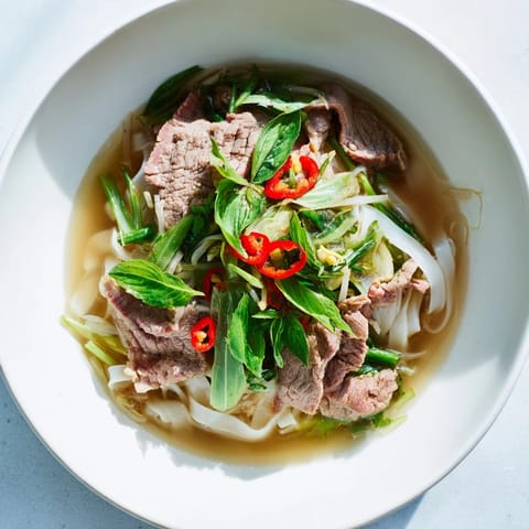 Enjoy a comforting bowl of Vietnamese Pho Express with flavorful broth and vibrant toppings.
