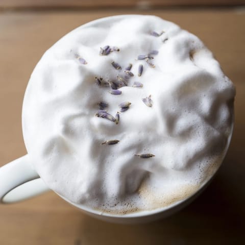 Homemade lavender syrup sweetens this Whipped Lavender Latte in glass mugs.