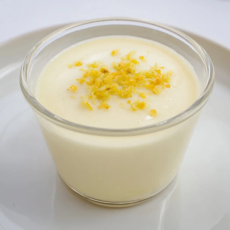 Silky 3-ingredient lemon posset, chilled and ready to serve, a simple yet elegant dessert.