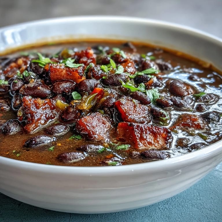 Comforting black bean and ham soup with jalapeños, rich in flavor and perfect for chilly evenings with crusty bread.