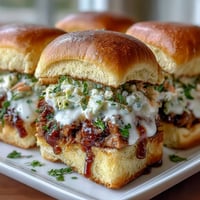 Juicy BBQ pulled pork sliders with creamy coleslaw, perfect for baby showers and backyard gatherings.  