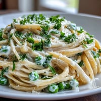 Spring Pasta: Ricotta and Lemon Linguine with Peas, a vibrant vegetarian dish with creamy ricotta, bright lemon, and tender peas.